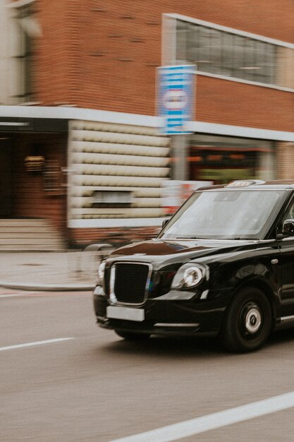 Vintage car travelling through London street