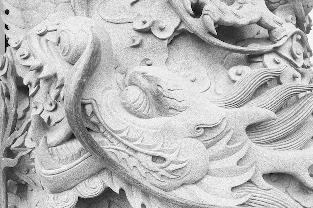 Vintage Chinese stone dragon sculpture Black and white image