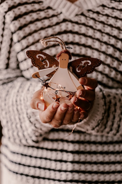 Vintage Christmas tree ornament in woman hands