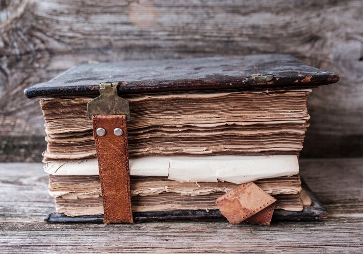 Vintage Church book with a leather clasp on a wooden table