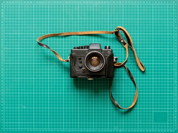 A vintage classic old fashioned photo camera, simple creative idea concept