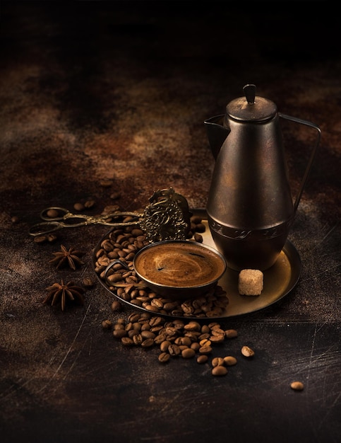 Vintage coffee set. Coffee pot,  cup coffee and coffee beans on a tray