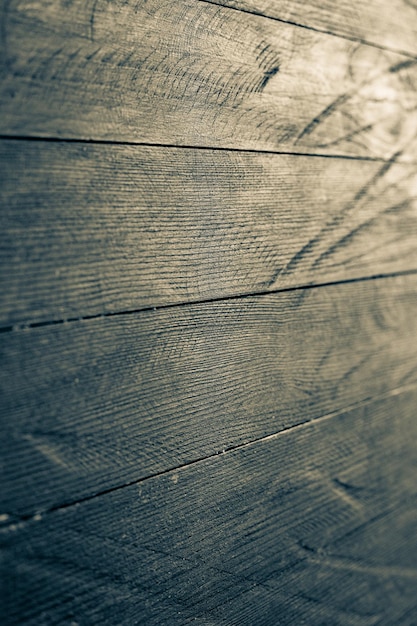 Photo vintage colored wood background texture with knots and nail holes. old painted wood wall. wooden dar