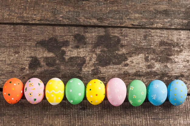 Vintage colorful easter eggs on wood table background