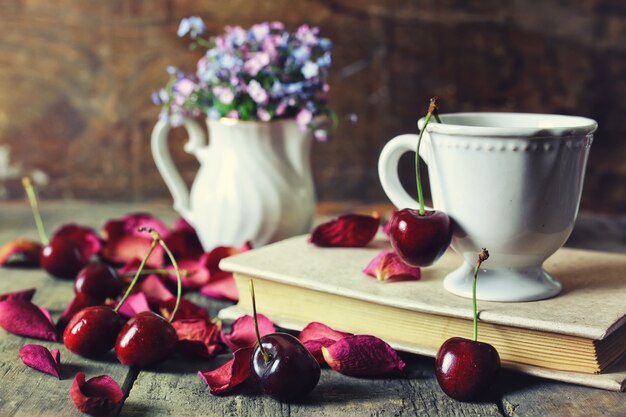 Vintage composition cherry berry on wooden background