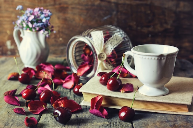 Vintage composition cherry berry on wooden background