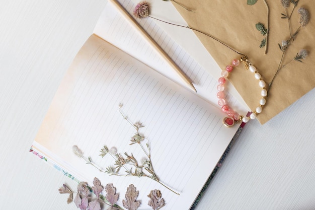 Vintage composition of dried plants and old sheets of paper