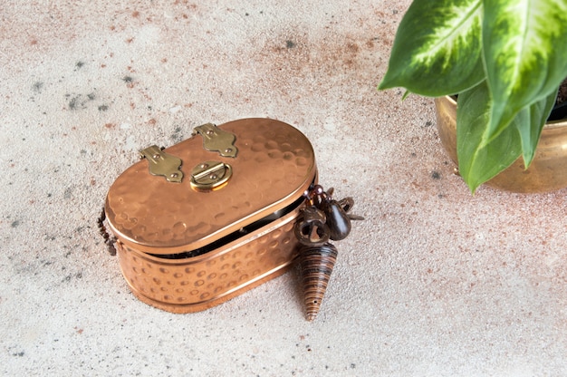  Vintage copper box on concrete background 