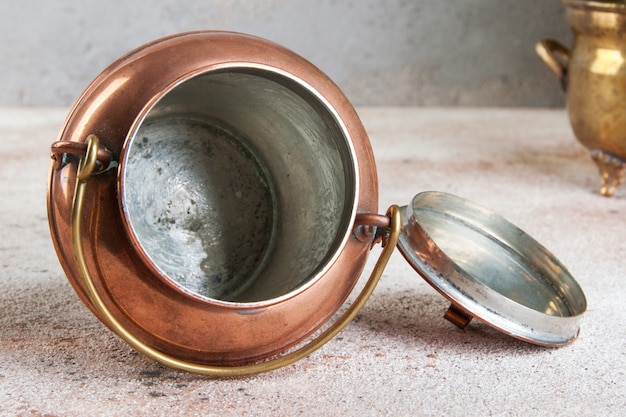 Vintage copper can and green plants