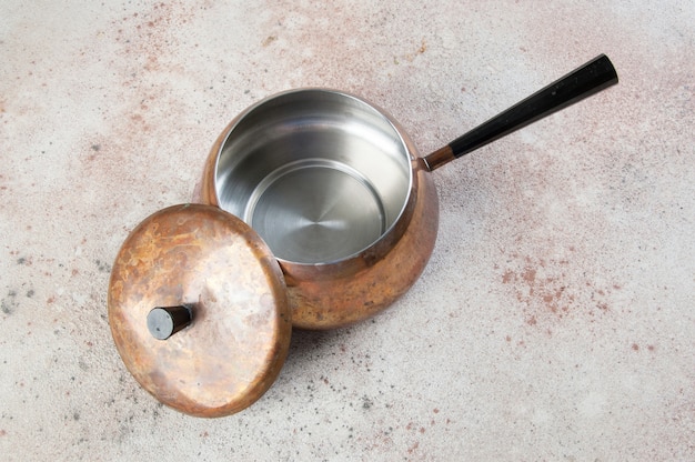 Vintage copper casserole with lid and black handle