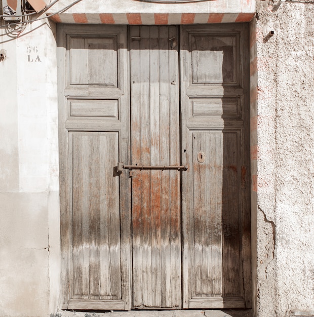 Vintage and damaged wood door texture or background