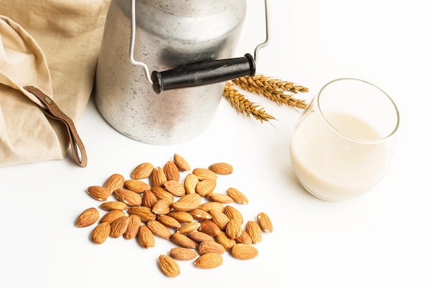 Vintage diary a glass of milk and almonds on a white table