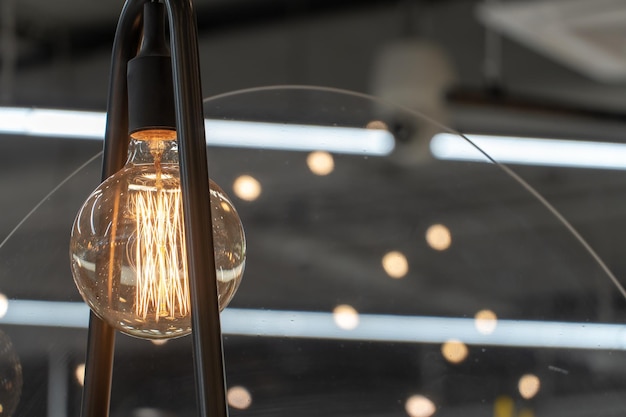 Vintage Edison lamp House interior of loft and rustic style Vintage light bulbs hang in a cafe or restaurant a unique design studio