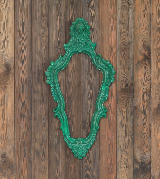 vintage elegant frame on wooden wall