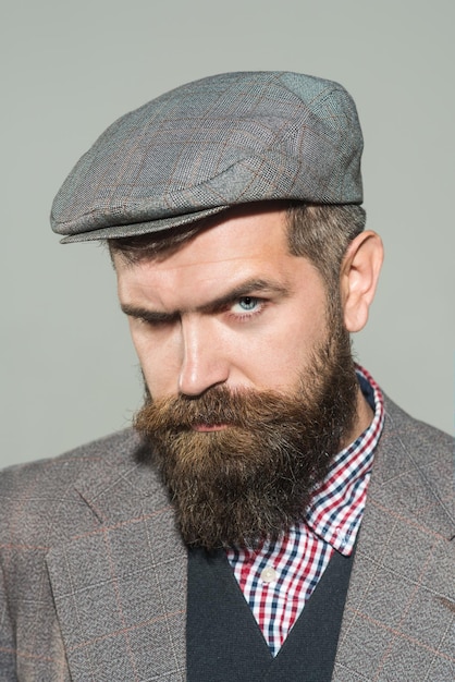 Vintage fashion man in suit shirt waistcoat cap fashionable bearded man elegant fashion man with