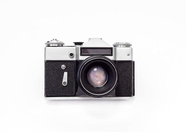 Photo vintage film camera close-up on a white background top view