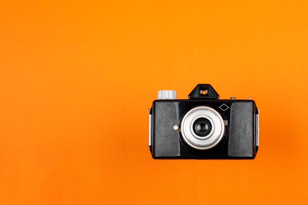 Vintage Film Camera isolated on red background