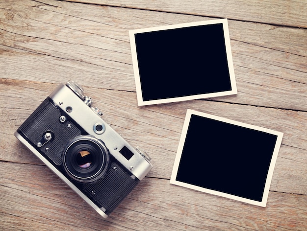 Vintage film camera and two blank photo frames