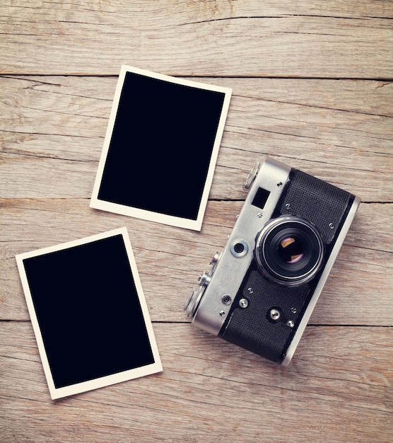 Vintage film camera and two blank photo frames