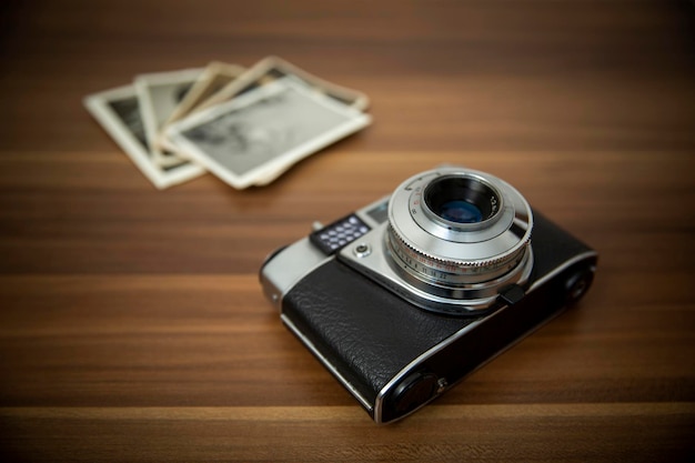 Vintage film camera on wood background