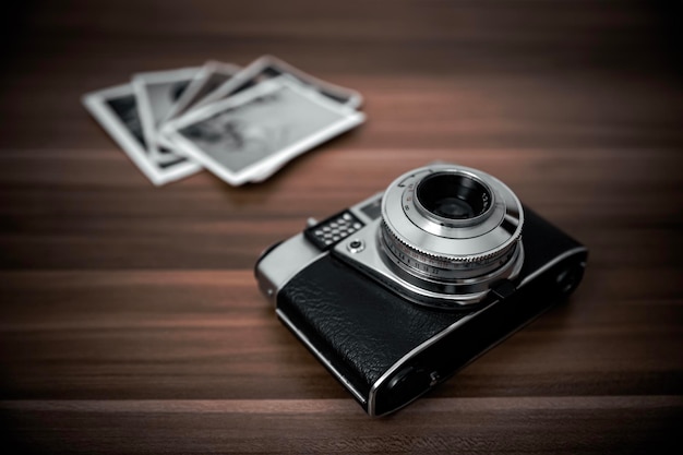 Vintage film camera on wood background