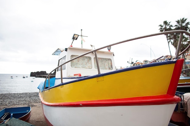 Vintage fish boat on the beach in Madeira island