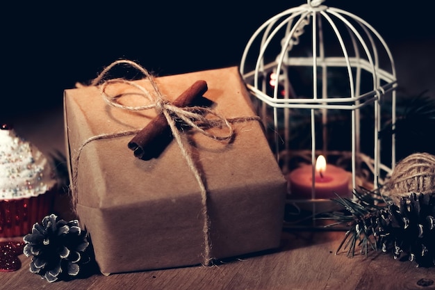 Vintage gift box and candle on a christmas background