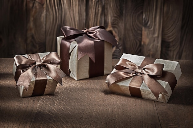 Vintage gift boxes on old wooden background