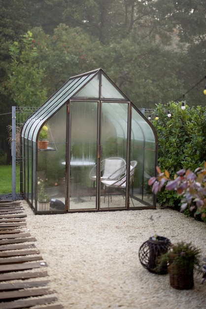 Vintage greenhouse in backyard