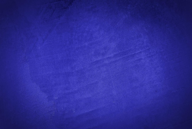 ビンテージ グランジ ネイビー ブルーのコンクリート テクスチャ スタジオの壁の背景にビネット