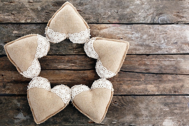 Vintage hearts on wooden background