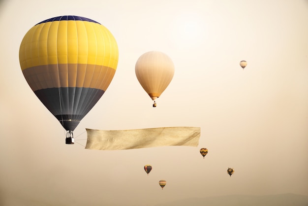 Vintage hot air balloon with blank flag for your add message - retro filter effect style