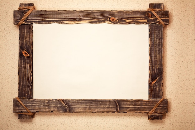 Foto vintage houten frame met canvas opgehangen aan de muur. kunst achtergrond