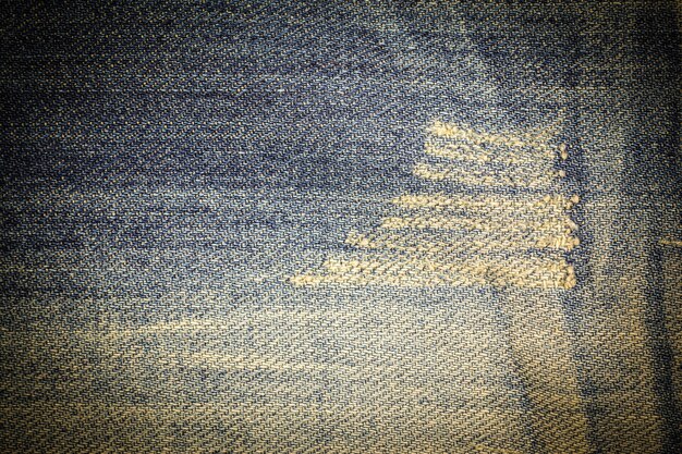 Vintage jeans torn denim texture.