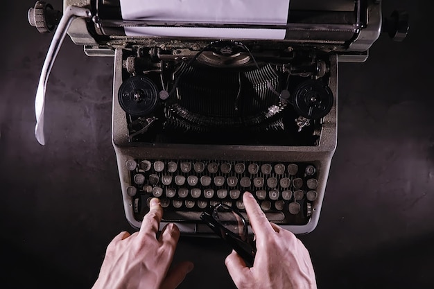 Vintage journalist tool. Typewriter retro. The writer is at work. Seal of the novel. Journalist writer concept.