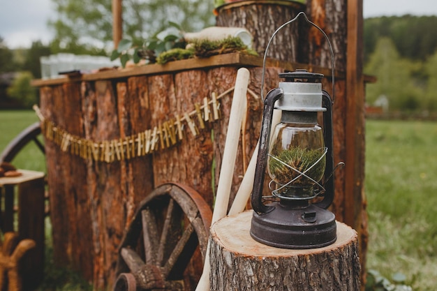 Vintage kerosene lamp in rustic boho wedding decor