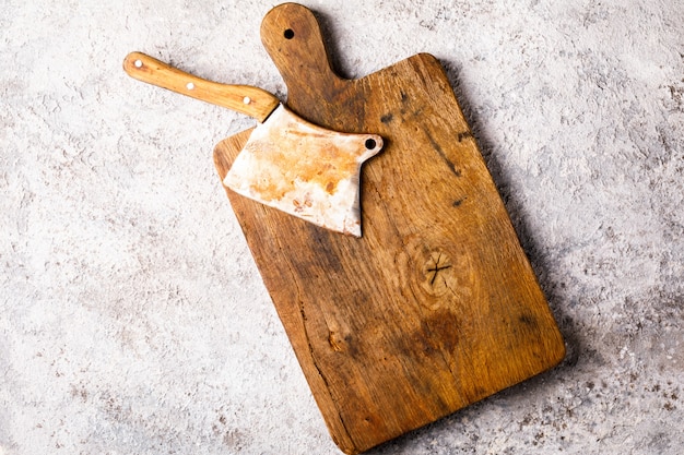 Vintage Kitchen Ax for felling Meat on a wooden board.