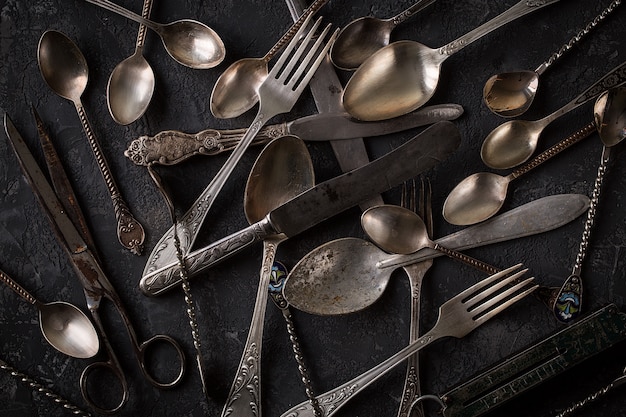 Vintage kitchen cutlery  on stone table