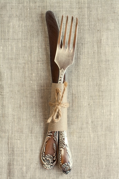 Vintage knife and fork on the tablecloth