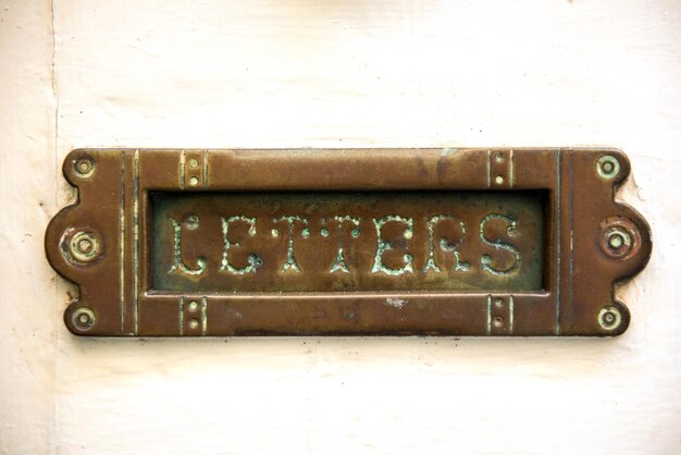 Photo vintage letterbox on white door