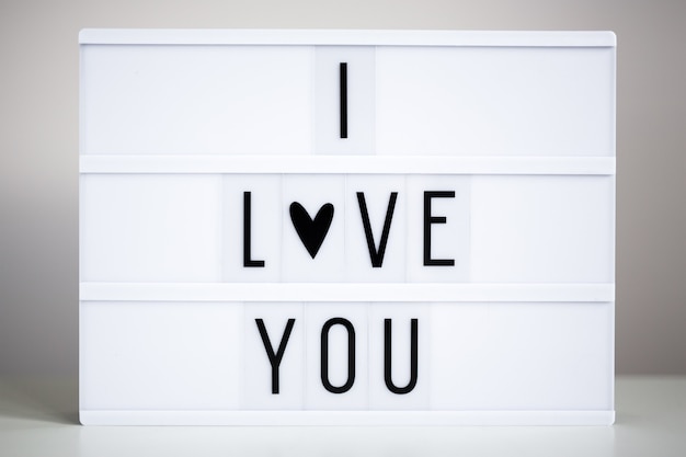 Vintage lightbox with text I love You on the table