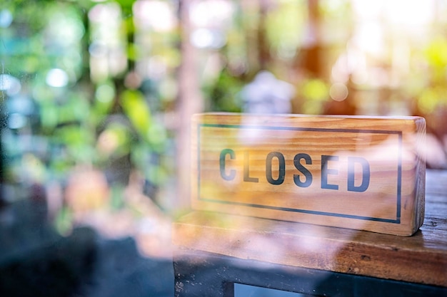 Vintage looking Closed sign in a shop showroom with reflections