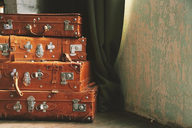 Vintage luggage on wooden floor.