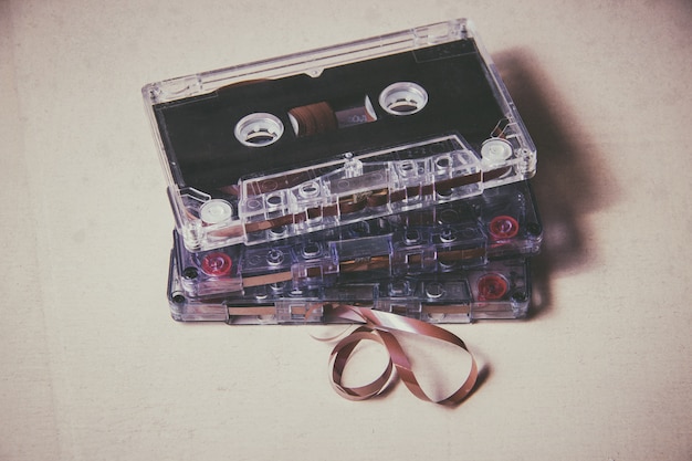 Vintage magnetic audio cassette on the wooden floor