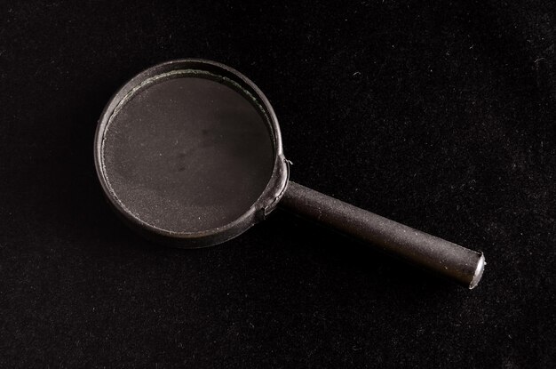 Vintage Magnify Glass Loupe on a Black Background