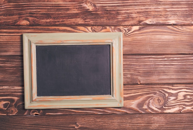 Vintage mini chalk board on the wooden background