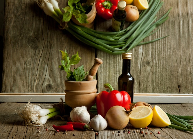 Vintage mortar and mix of vegetables with reflex