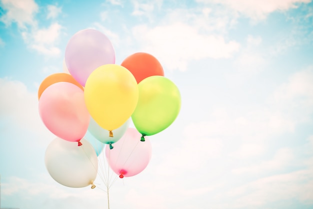 Vintage multicolor balloons on blue sky