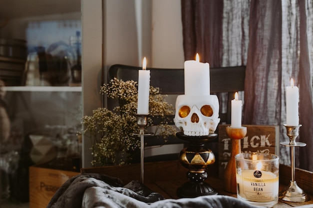 Vintage old Halloween book with skull candle at night - 3d rendering