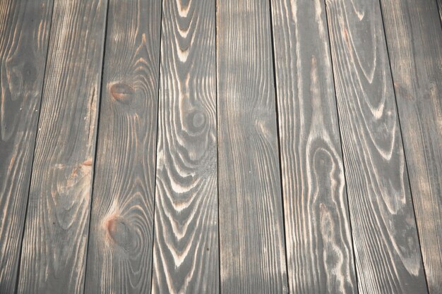 Vintage old wooden background. Grey and brown antique panels. Rough texture. Shaggy and grained floor.